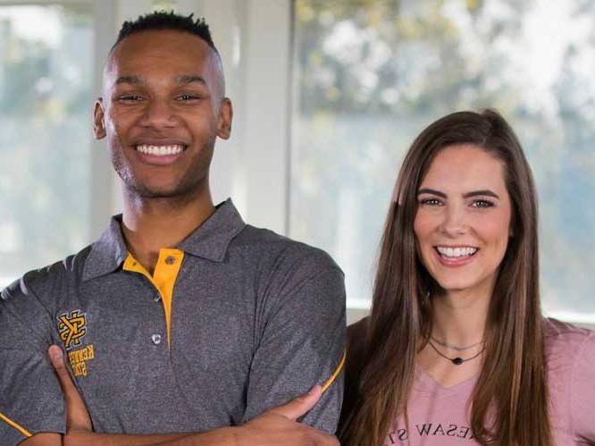 Man and woman smiling for picture