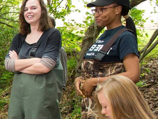 Group of students out doors communicating